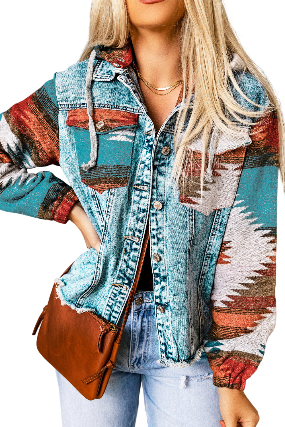 Women’s multicolor Aztec print denim jacket with hood and frayed hem, styled with jeans and leather bag”