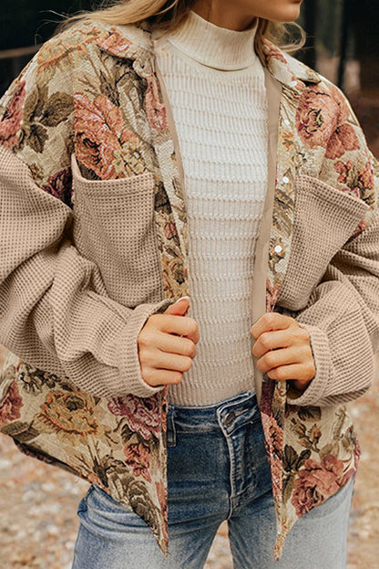 Sophisticated khaki floral patchwork waffle knit jacket with button-down front and pockets. A boho casual outerwear piece perfect for layering.