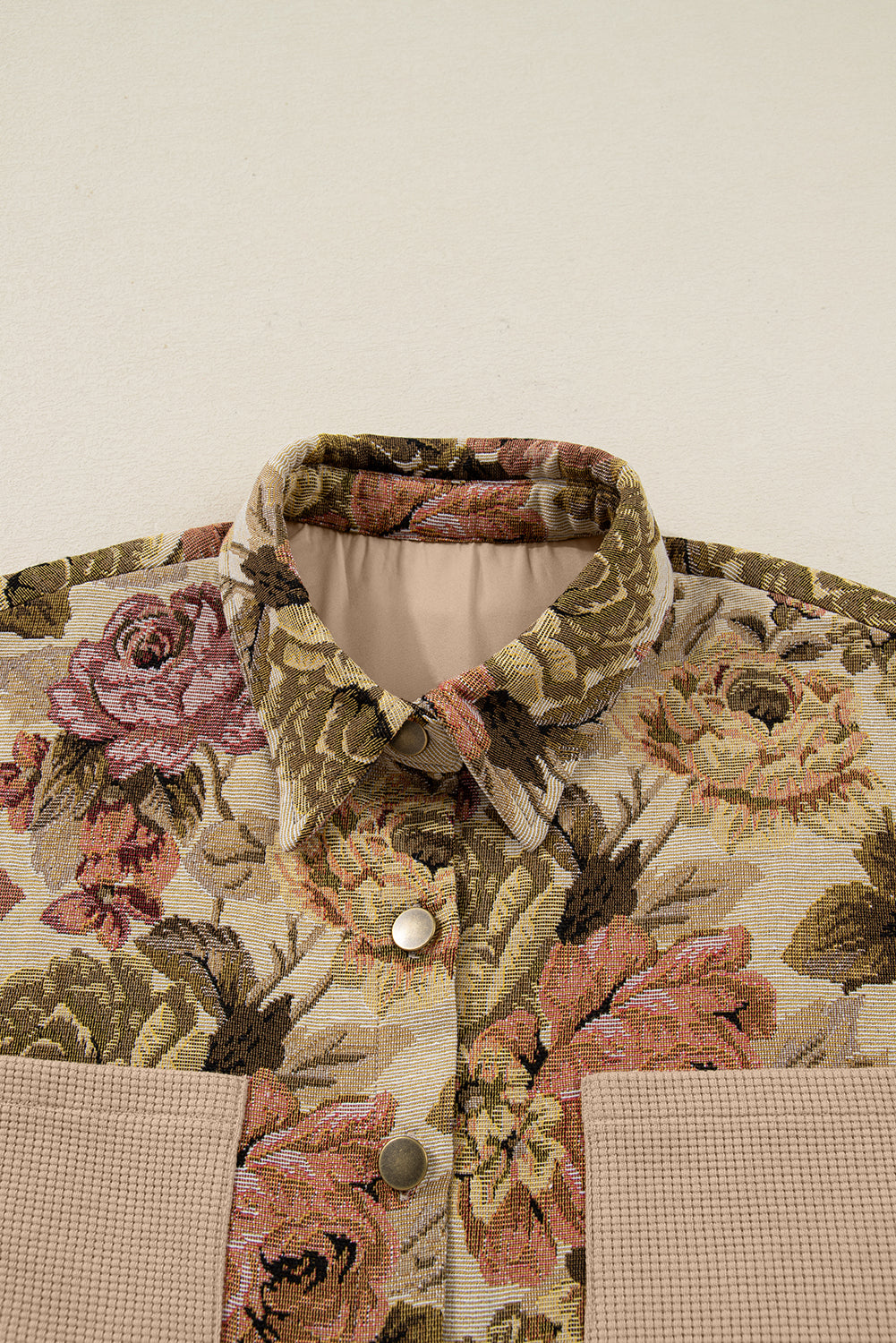 Sophisticated khaki floral patchwork waffle knit jacket with button-down front and pockets. A boho casual outerwear piece perfect for layering.
