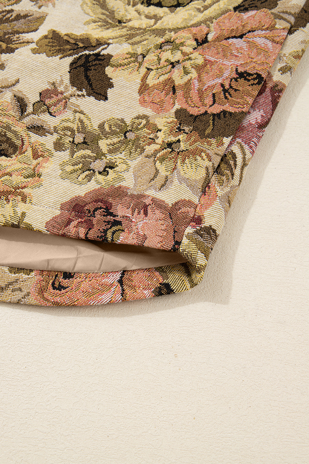 Sophisticated khaki floral patchwork waffle knit jacket with button-down front and pockets. A boho casual outerwear piece perfect for layering.