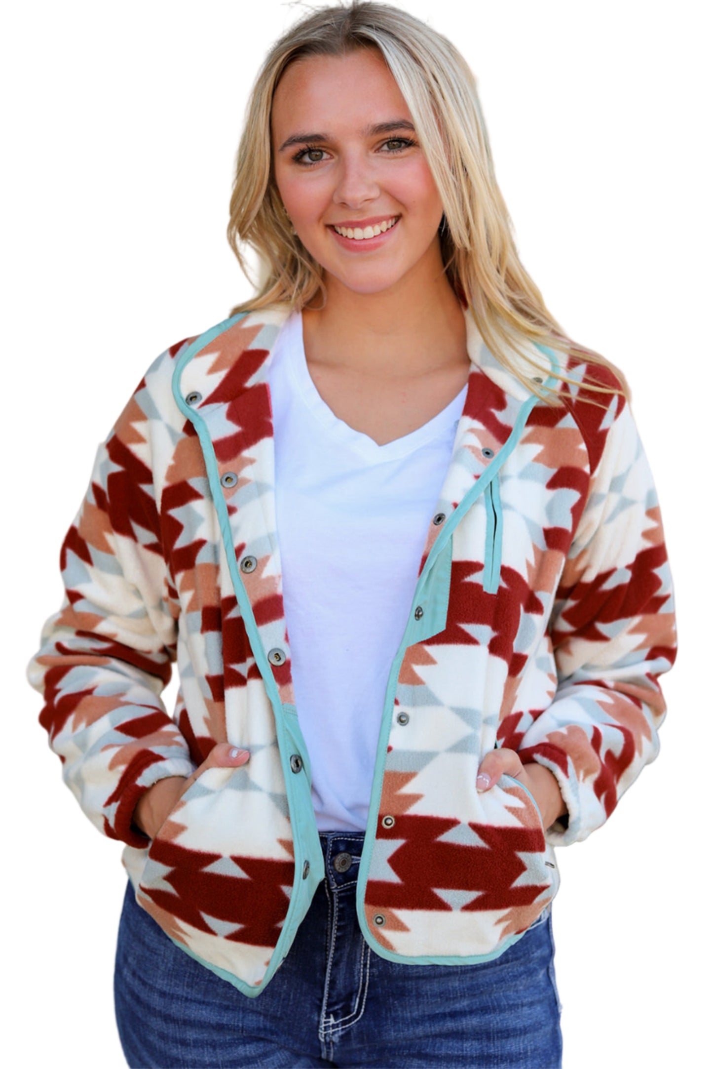 Woman wearing a patterned cardigan with a blurred outdoor background