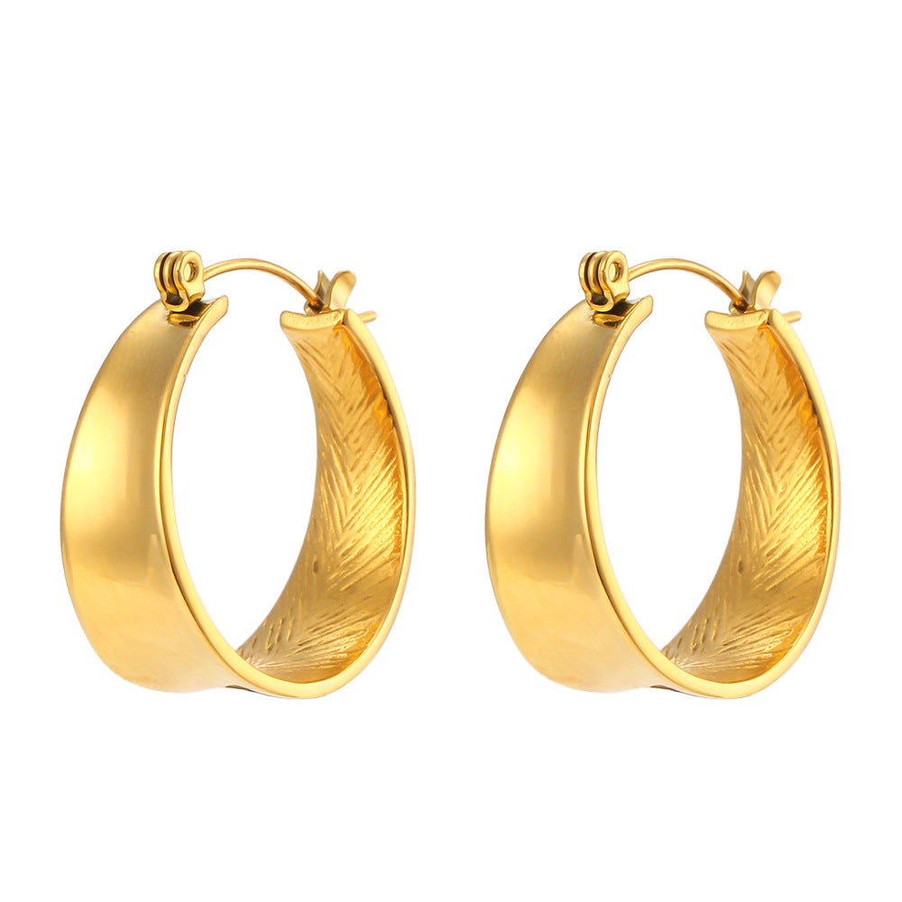 Gold hoop earrings on a white background