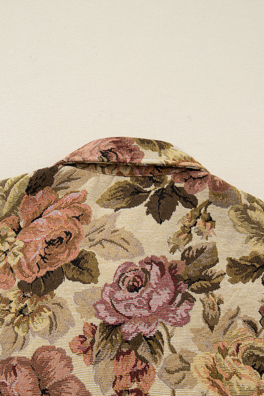 Sophisticated khaki floral patchwork waffle knit jacket with button-down front and pockets. A boho casual outerwear piece perfect for layering.